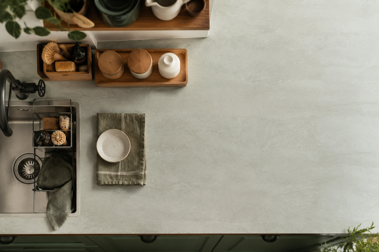 Overhead view of a small organized kitchen counter split into tidy zones